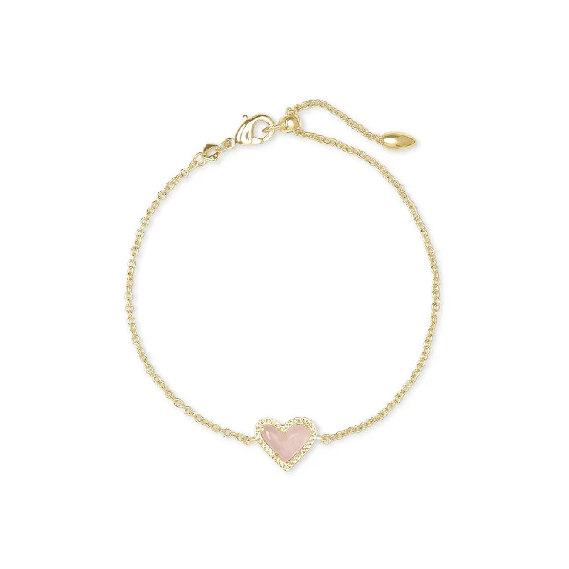 Women classic silver bangles and bracelets -Kendra Scott Ari Heart Gold Delicate Chain Bracelet in Rose Quartz